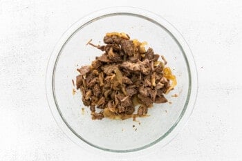 shredded beef in a glass bowl