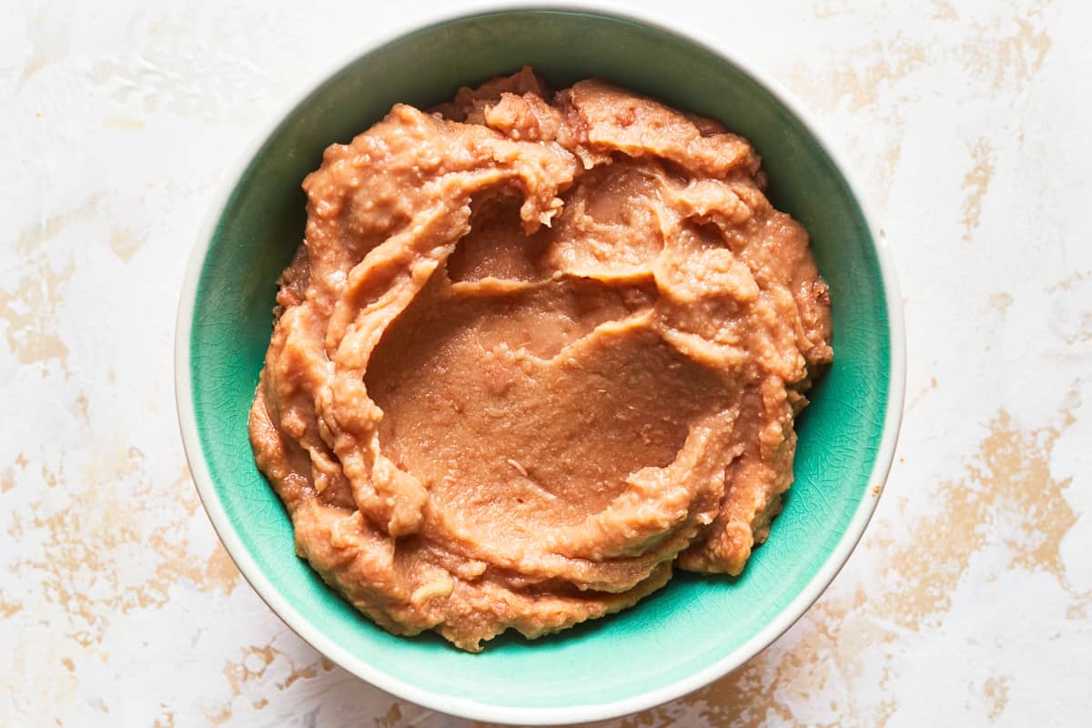 Refried beans in a bowl. - 8