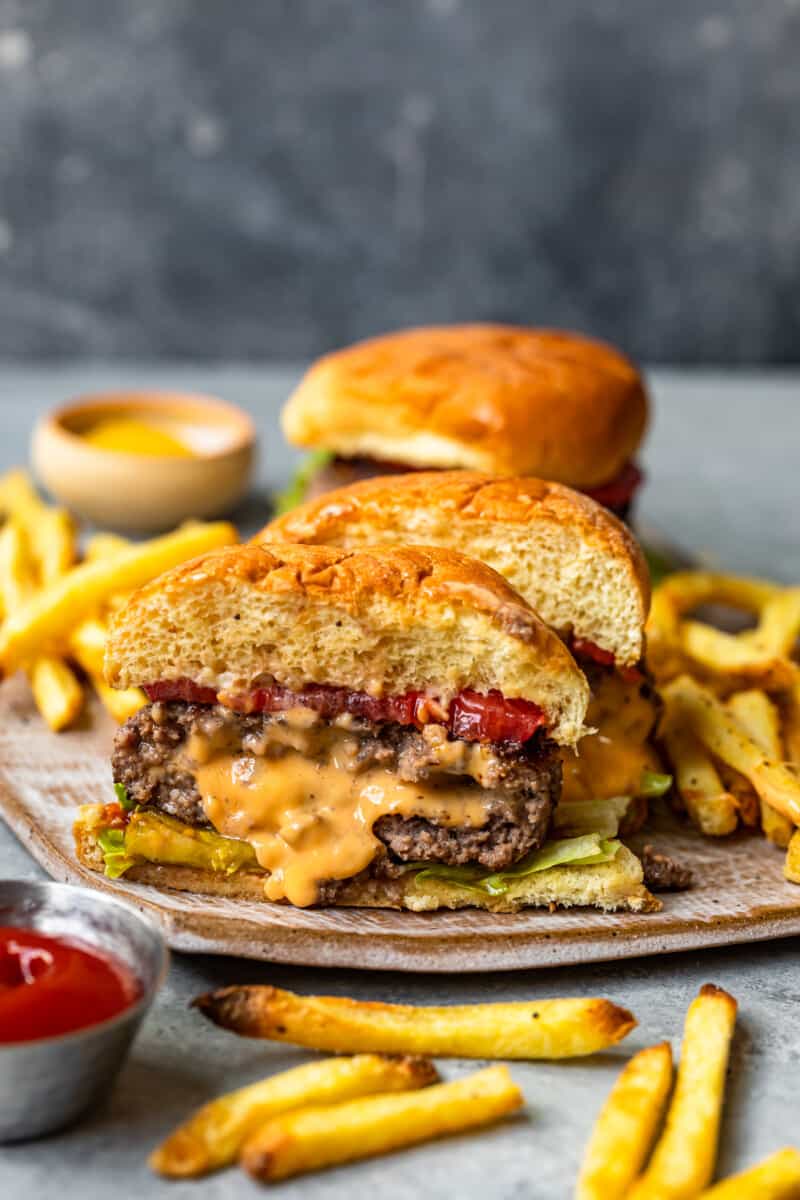 cheese stuffed burger cut in half showing the melted cheese filling