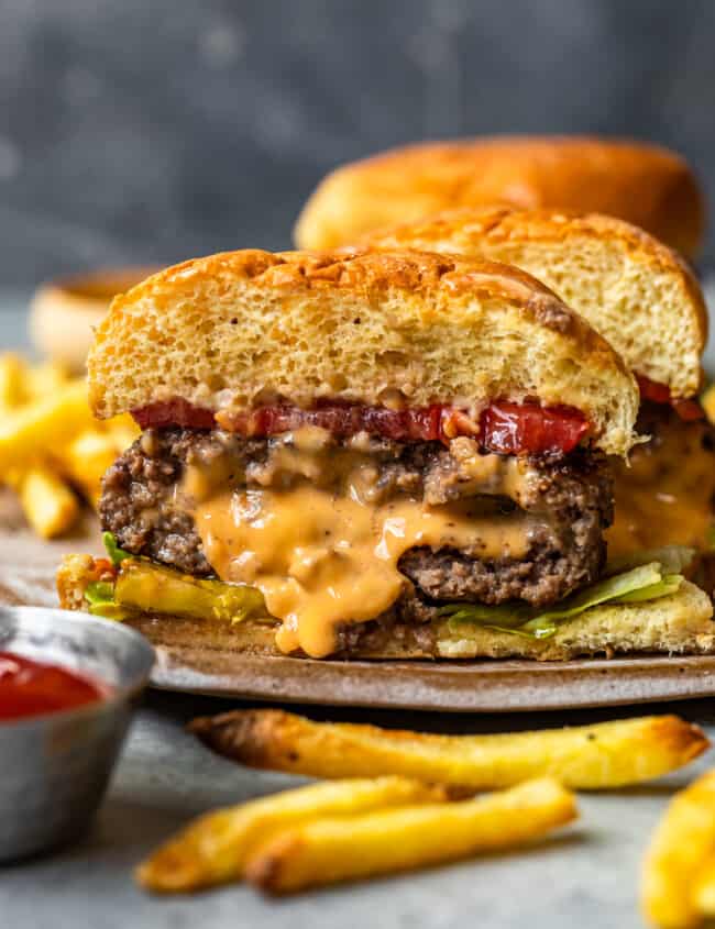 cheese stuffed burger cut in half showing the melted cheese filling