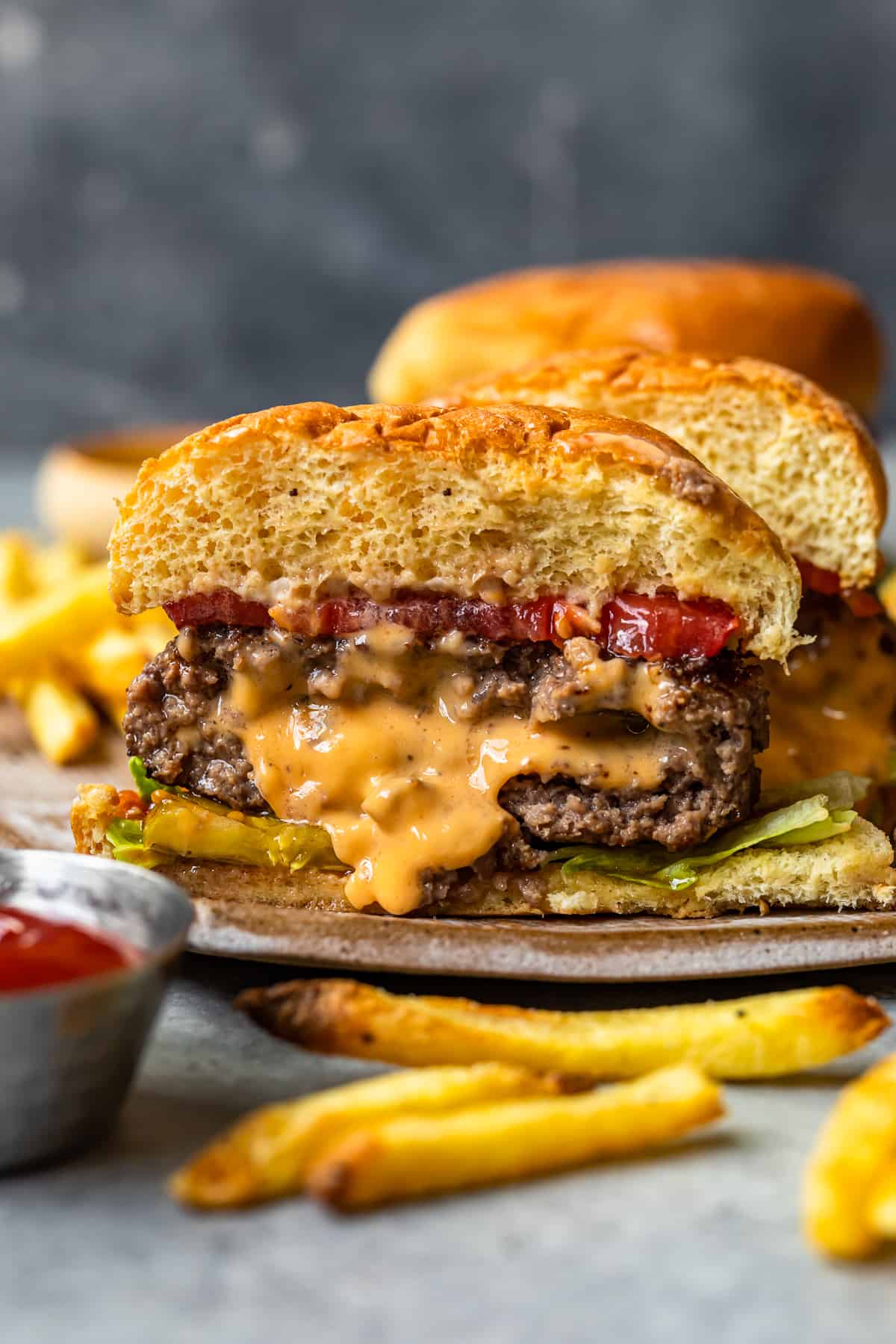 cheese stuffed burger cut in half showing the melted cheese filling