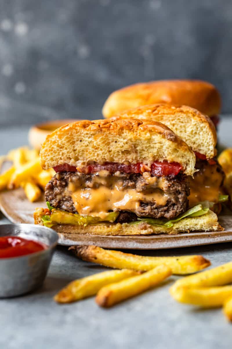 cheese stuffed burger cut in half showing the melted cheese filling