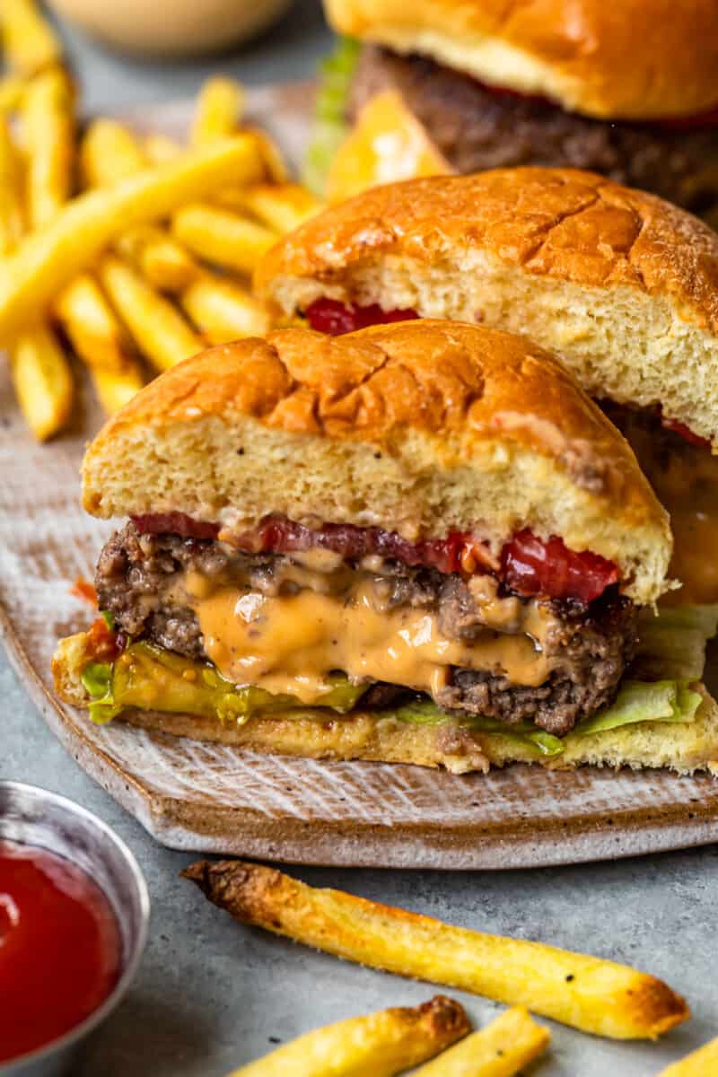 cheese stuffed burger cut in half showing the melted cheese filling