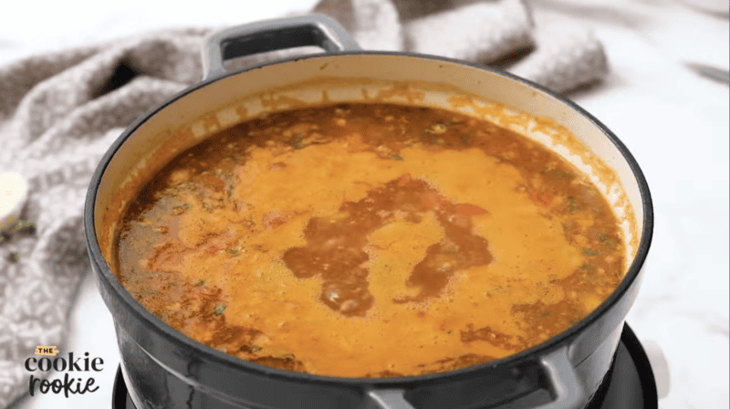 stuffed pepper soup simmering in a dutch oven.