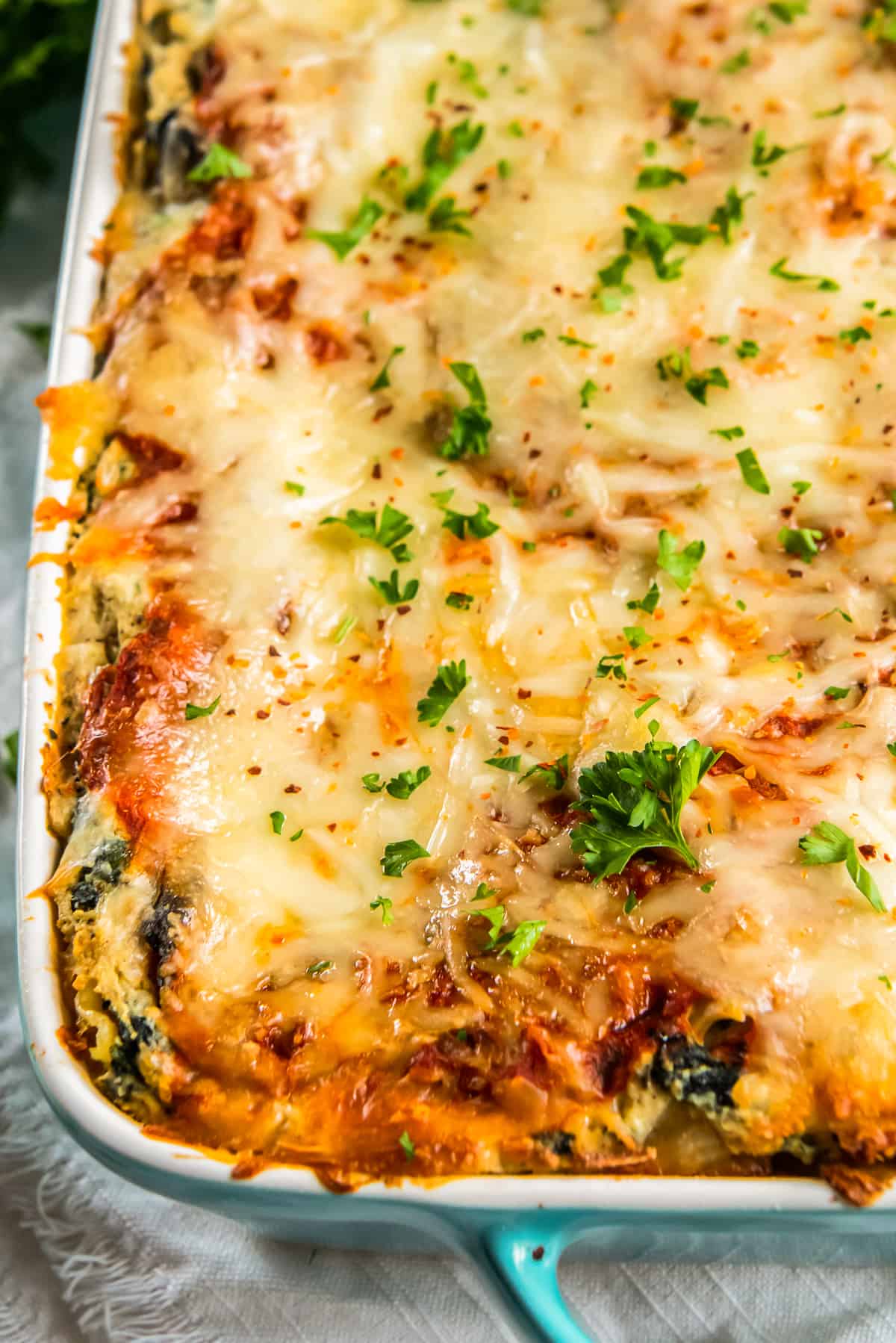 overhead image of vegetarian lasagna after baking in a baking dish