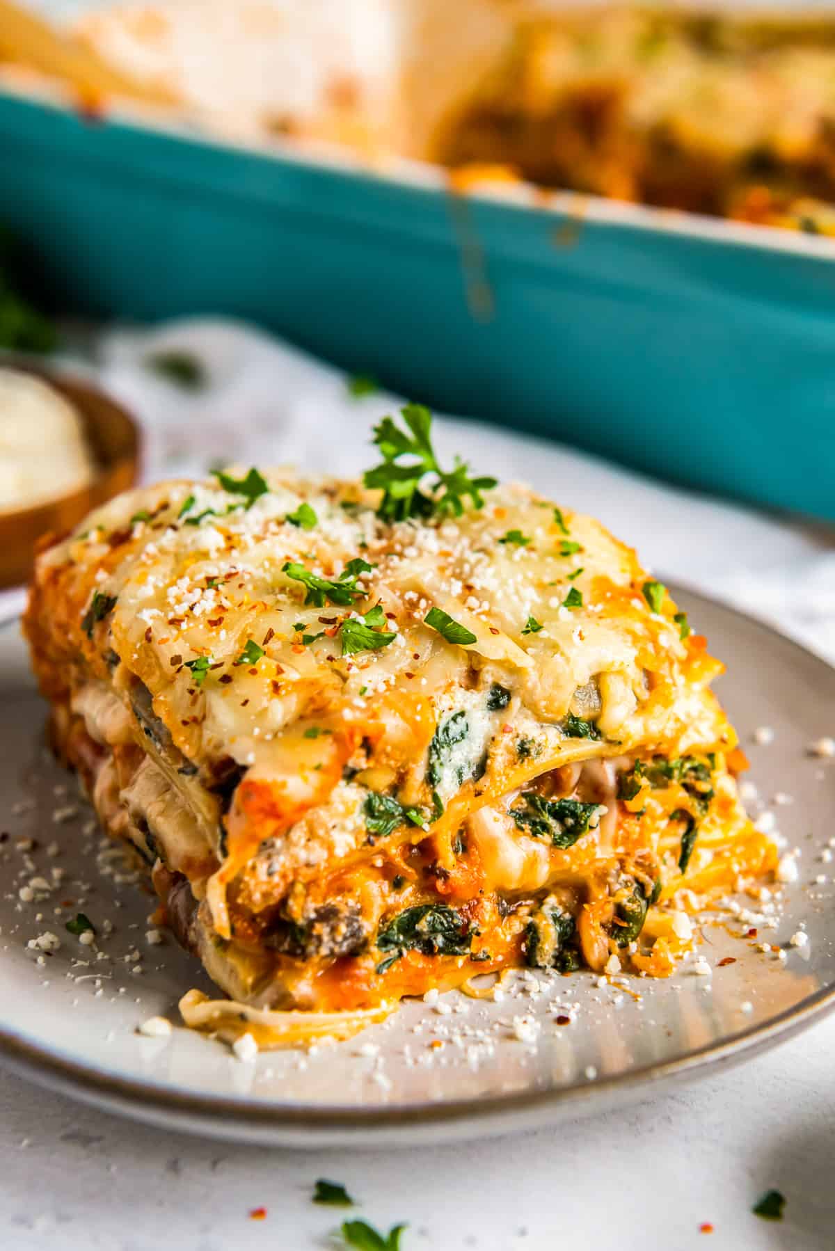 slice of vegetarian lasagna on a white plate