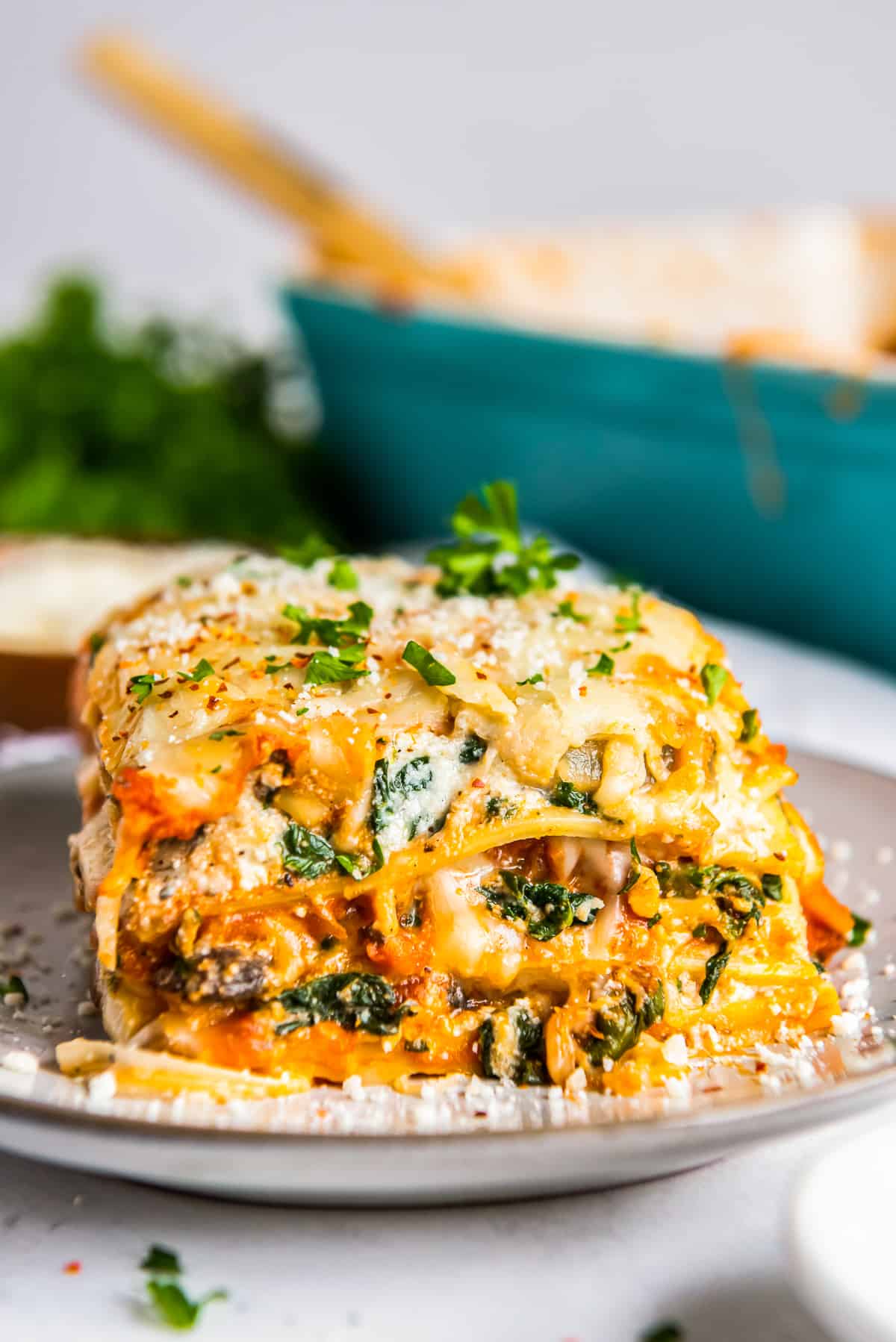 slice of vegetarian lasagna on a white plate