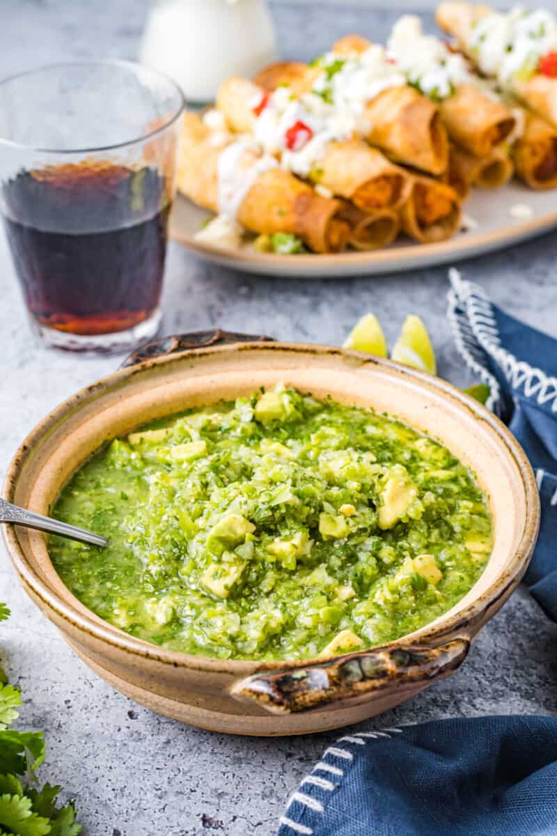 tomatillo avocado salsa in a bowl with a spoon