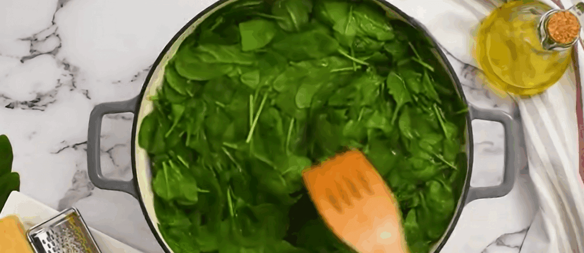 Blanching spinach in a pot.  - 8