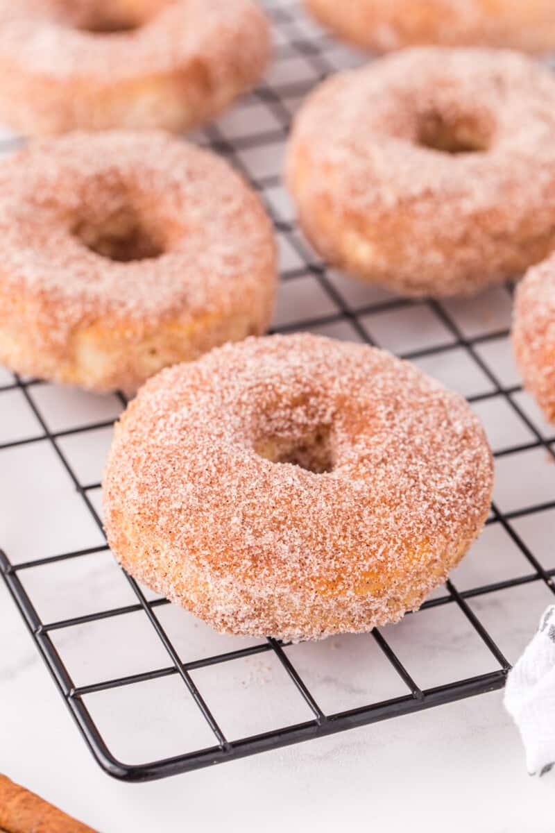 cinnamon sugar donuts on a cooling rack