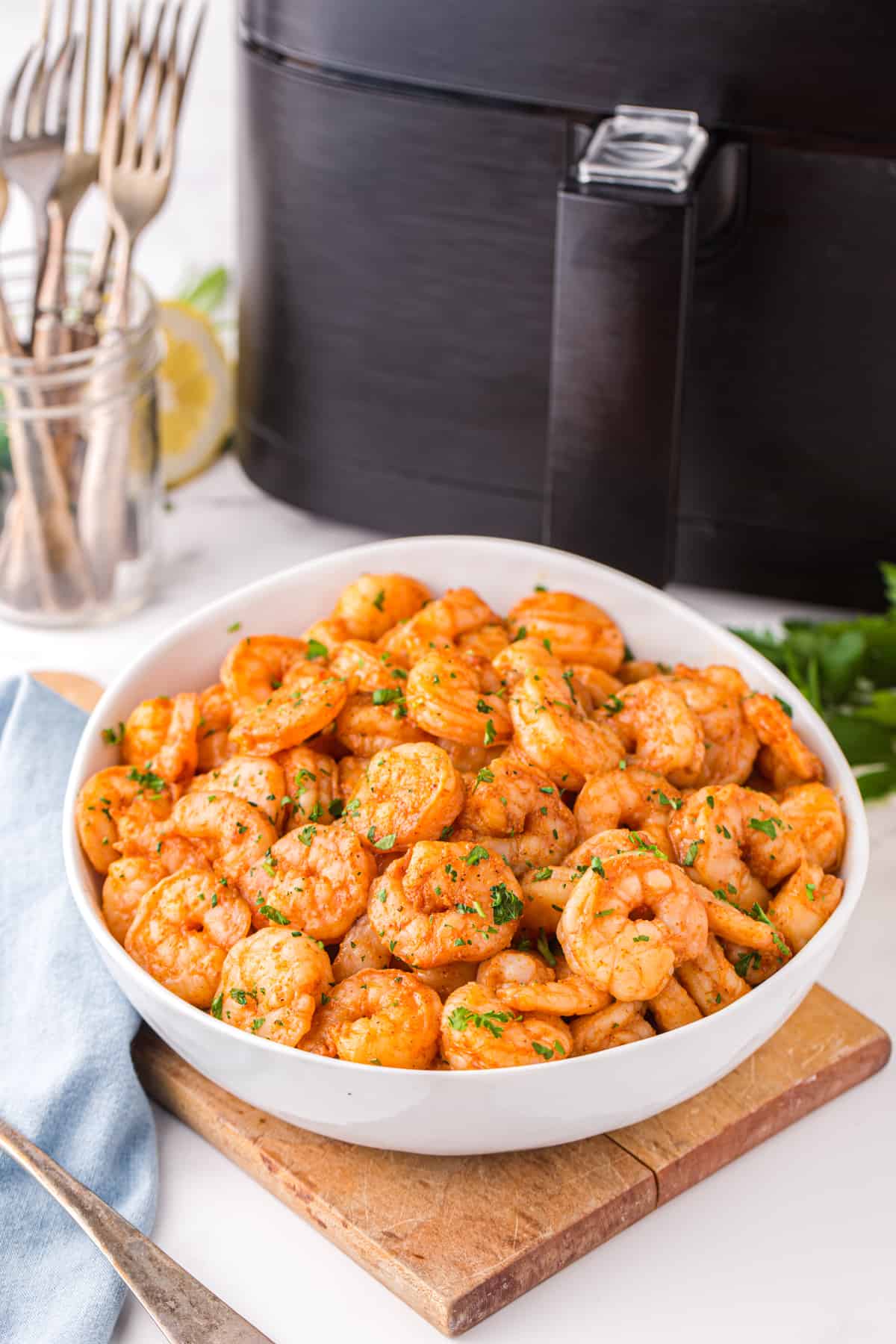 spicy shrimp in a white serving bowl