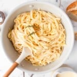 fettuccine Alfredo in a pot with a spoon