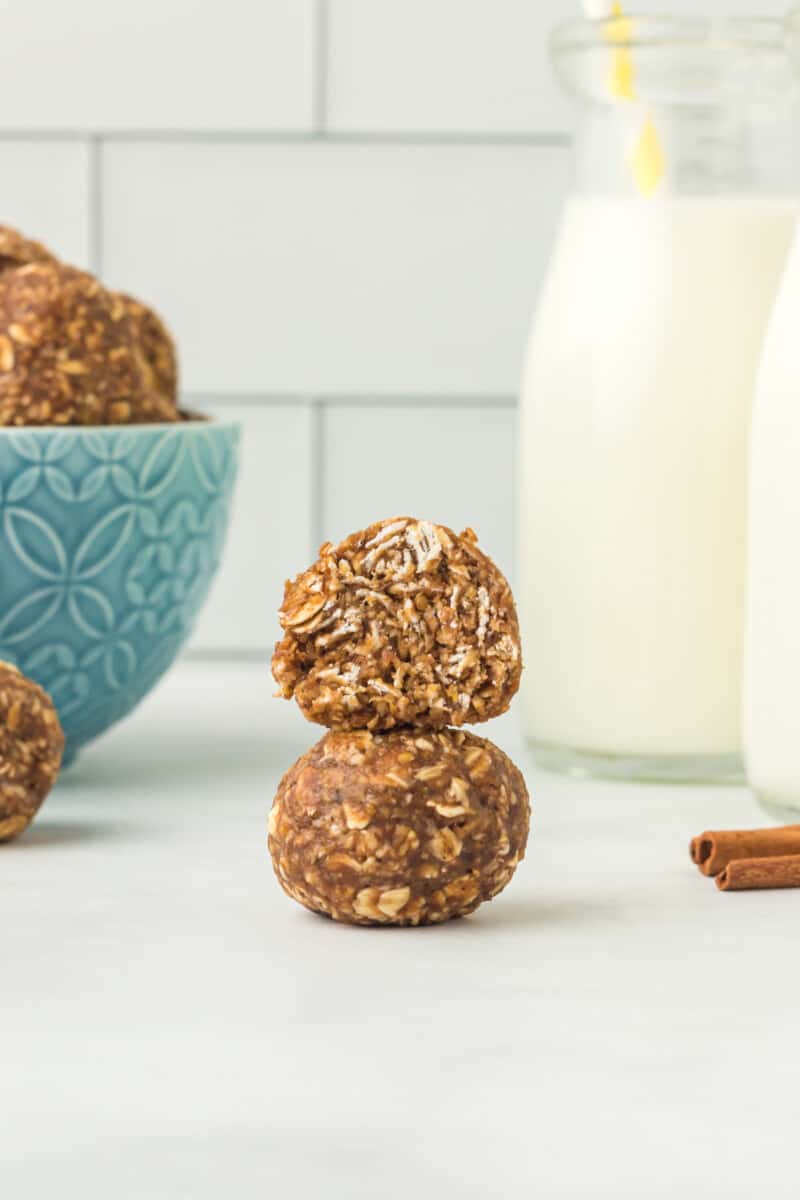 stack of 2 banana bread protein balls with a bite taken from the top one