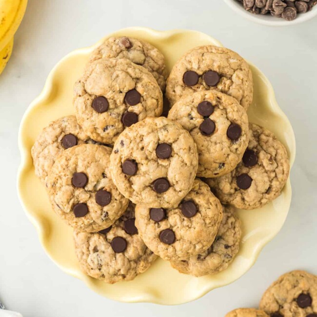 overhead image of banana breakfast cookies on a yellow plate