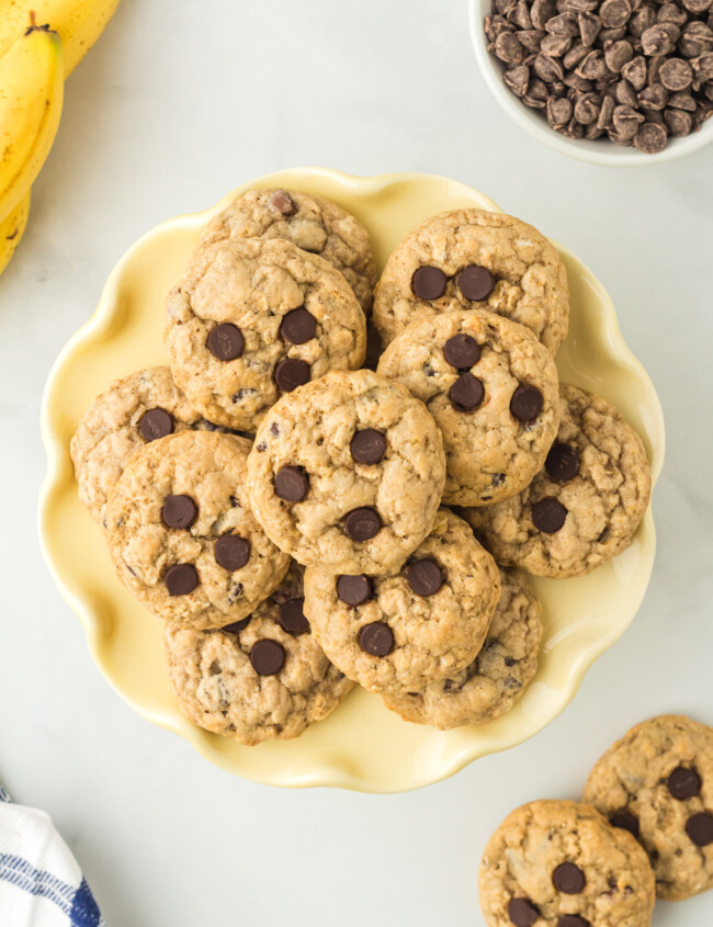 overhead image of banana breakfast cookies on a yellow plate