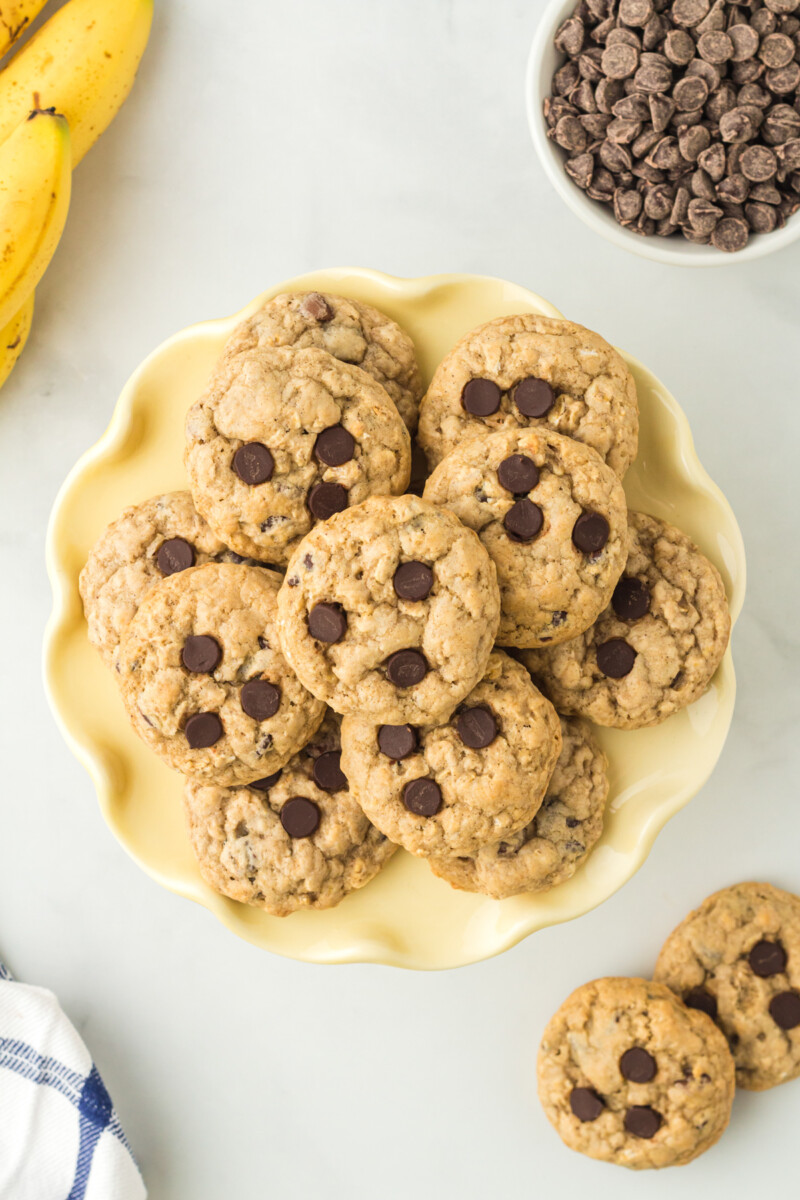 overhead image of banana breakfast cookies on a yellow plate