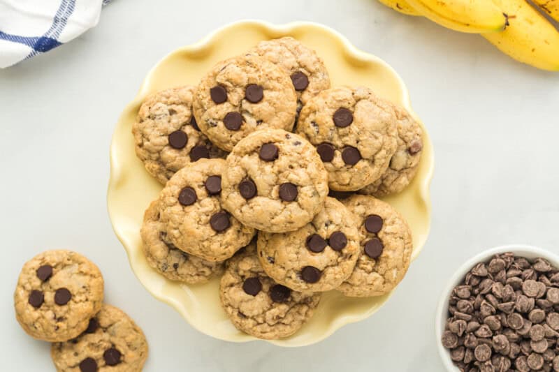 overhead image of banana breakfast cookies on a yellow plate