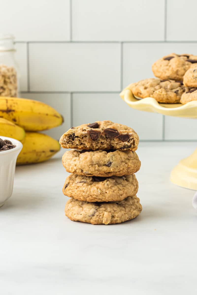 stack of 4 banana breakfast cookies with a bite taken from the top cookie