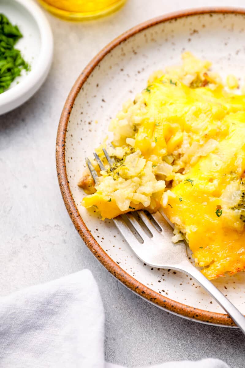 serving of broccoli rice casserole on a plate with a fork