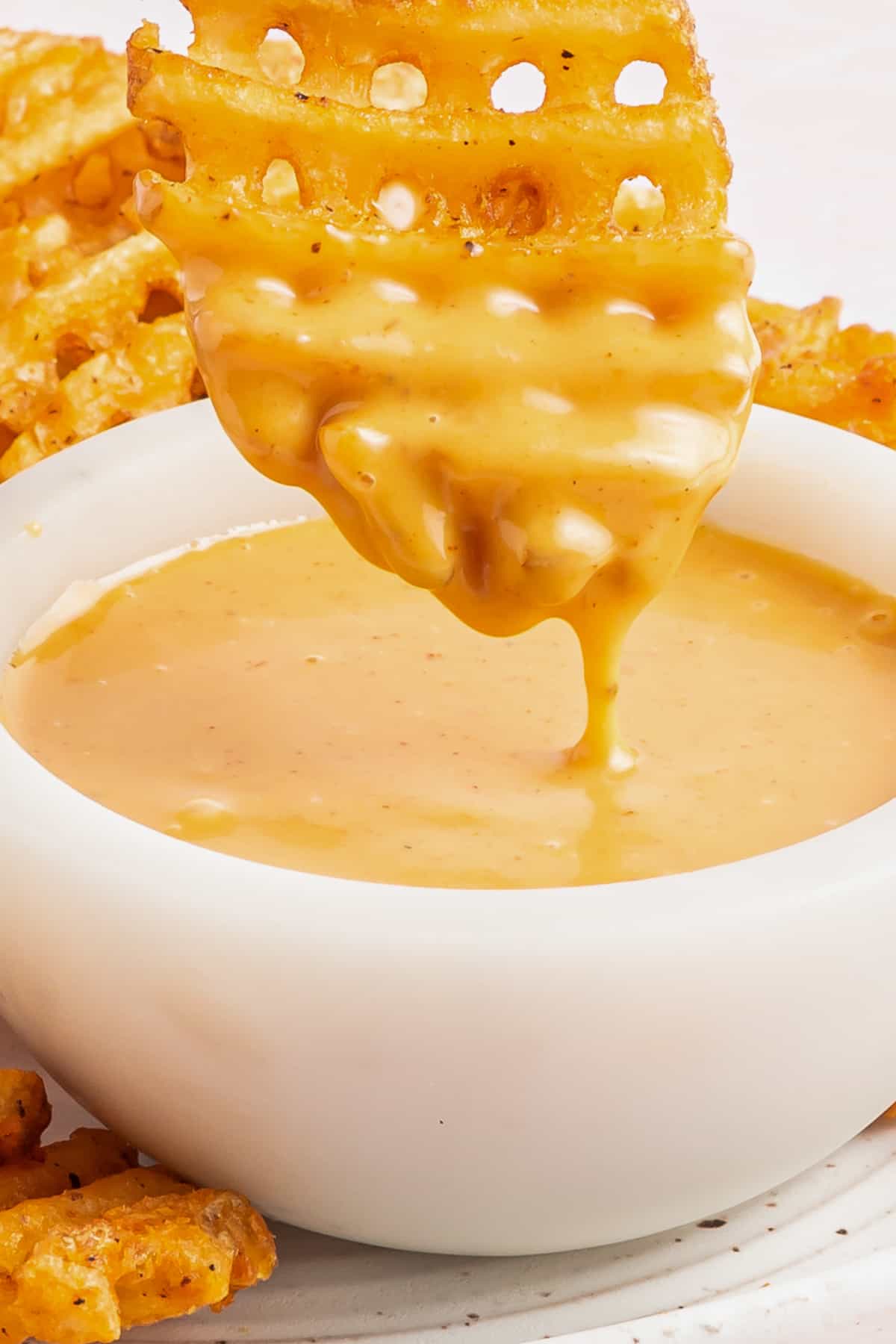 waffle fry dipped into chick-fil-a sauce
