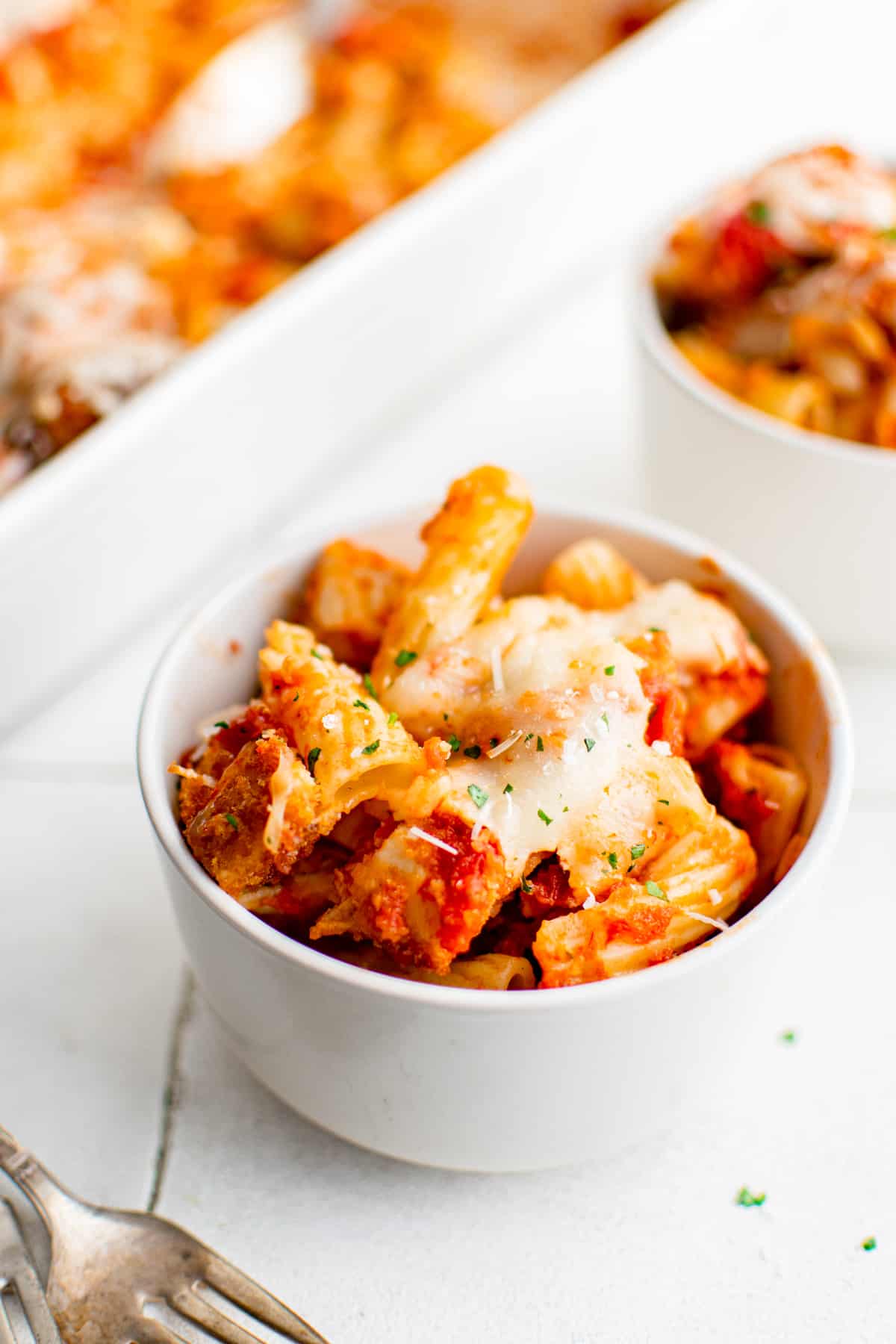 serving of chicken parmesan casserole in a white bowl