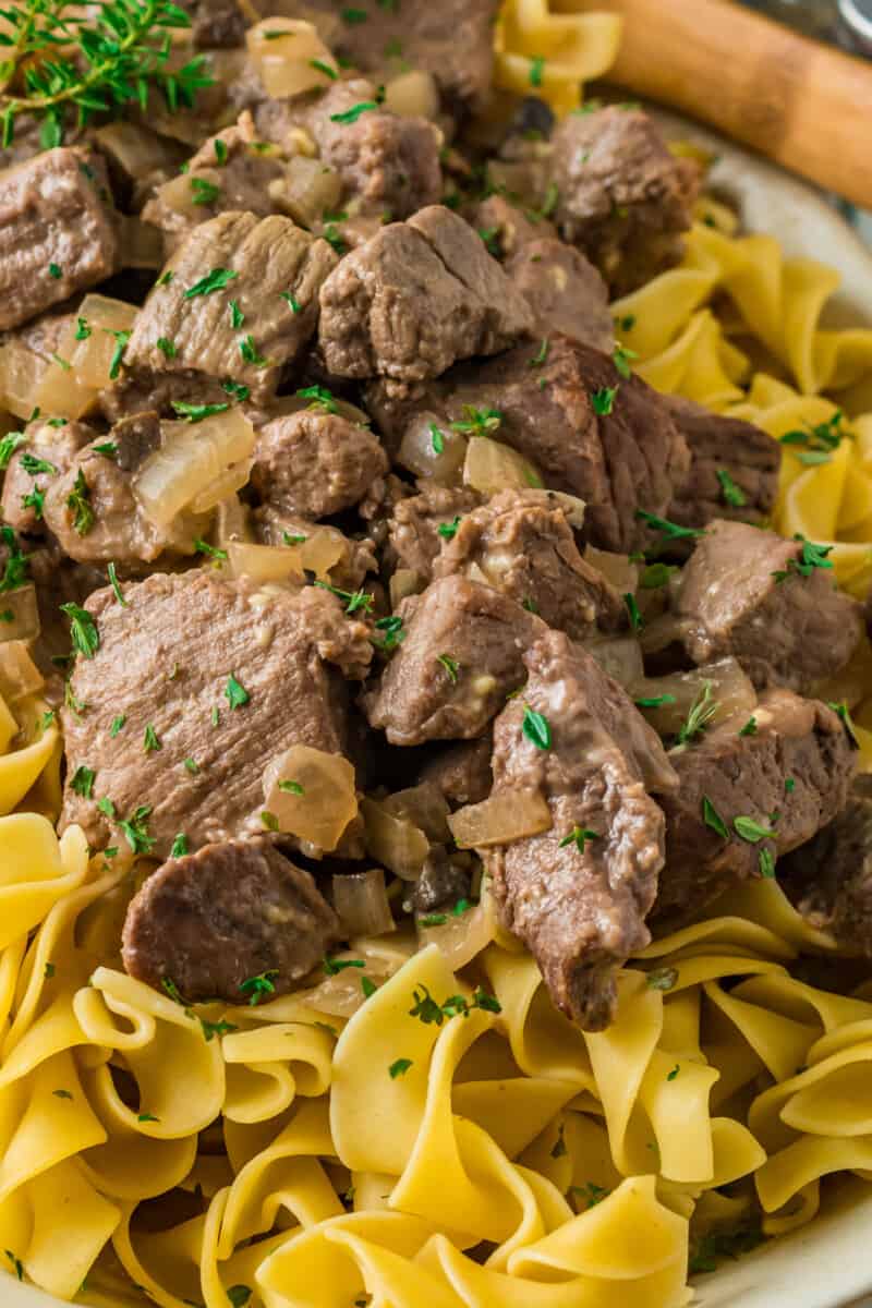 beef and noodles on a white serving platter
