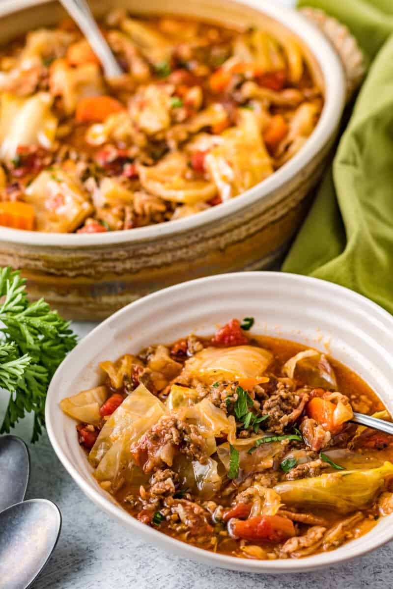 cabbage roll soup in a white bowl with a spoon