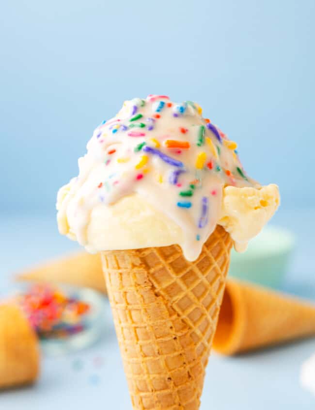 vanilla ice cream cone topped with funfetti magic shell