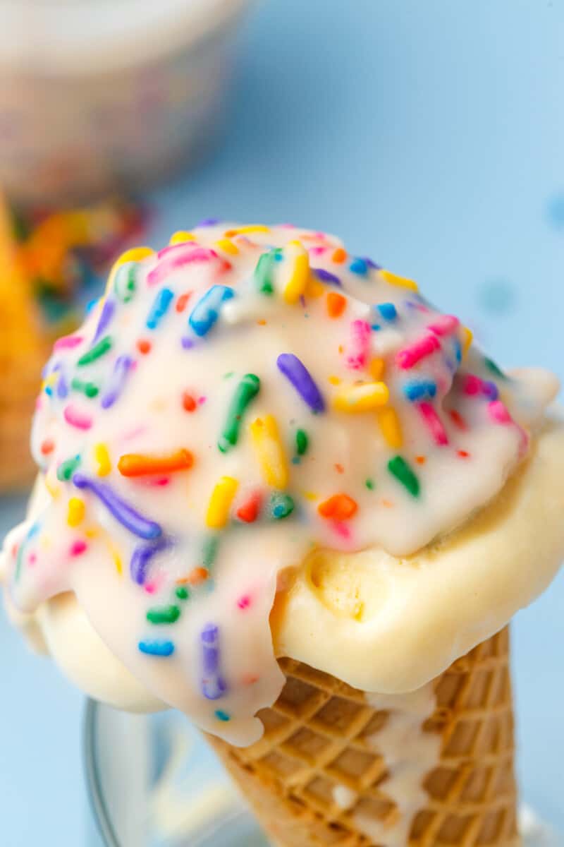 vanilla ice cream cone topped with funfetti magic shell