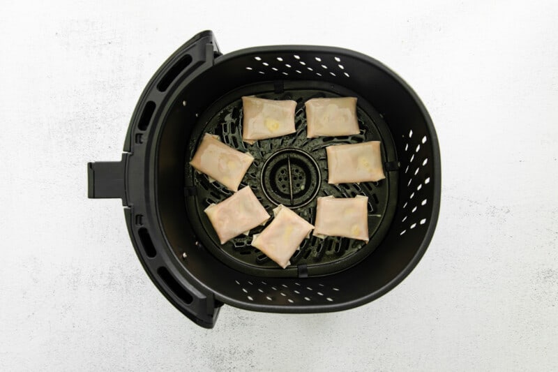pizza rolls in an air fryer before cooking