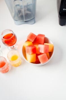 orange and grapefruit juice ice cubes in a bowl