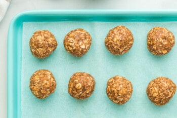 banana bread protein balls on a parchment paper lined baking sheet