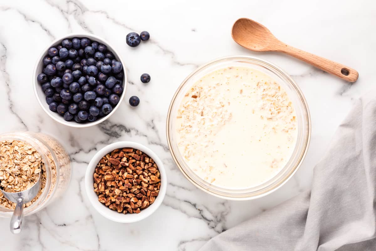 Milk and oat mixture in a glass bowl. - 9