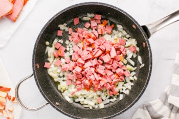 diced onion and corned beef in a skillet