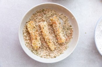 breaded fish sticks in a white bowl