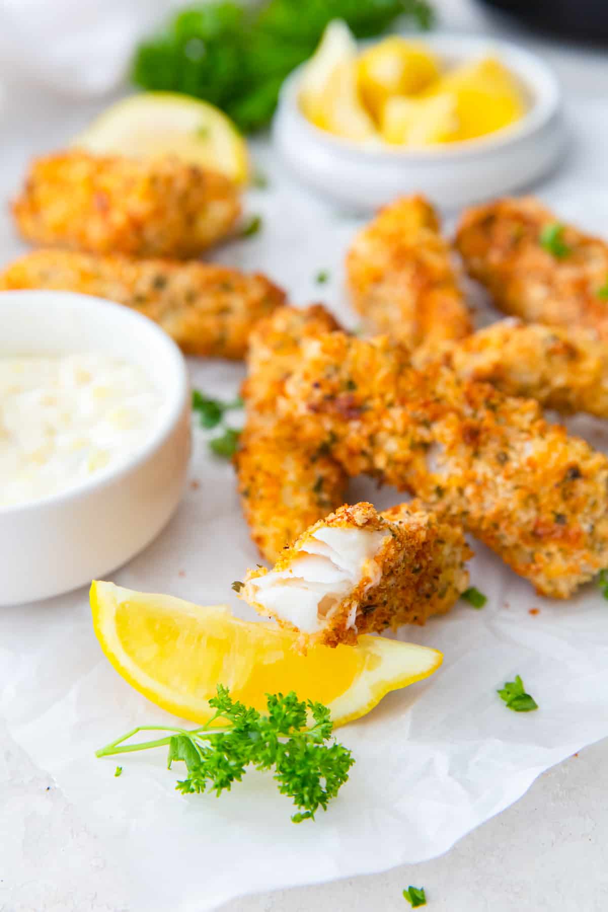 air fryer fish sticks with a bit taken from one