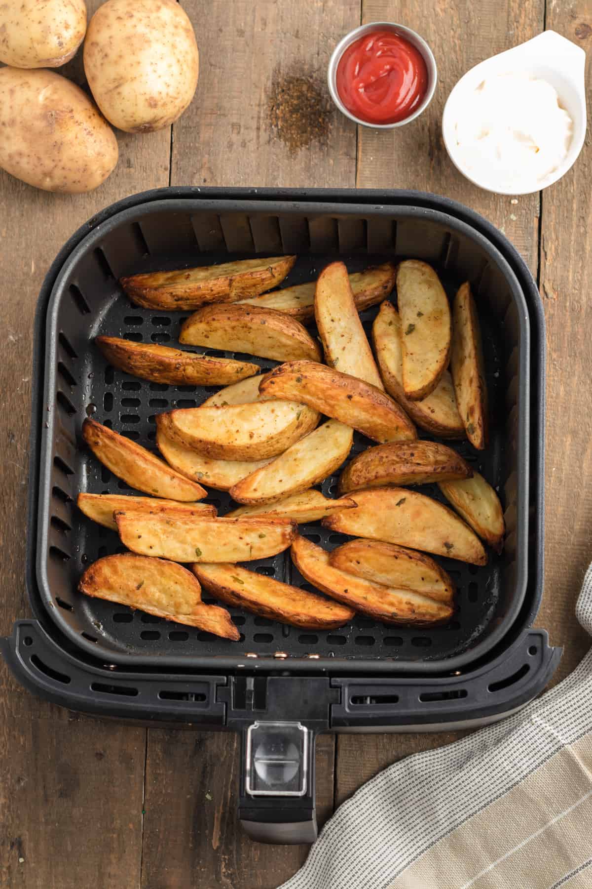 air fryer potato wedges in air fryer after cooking