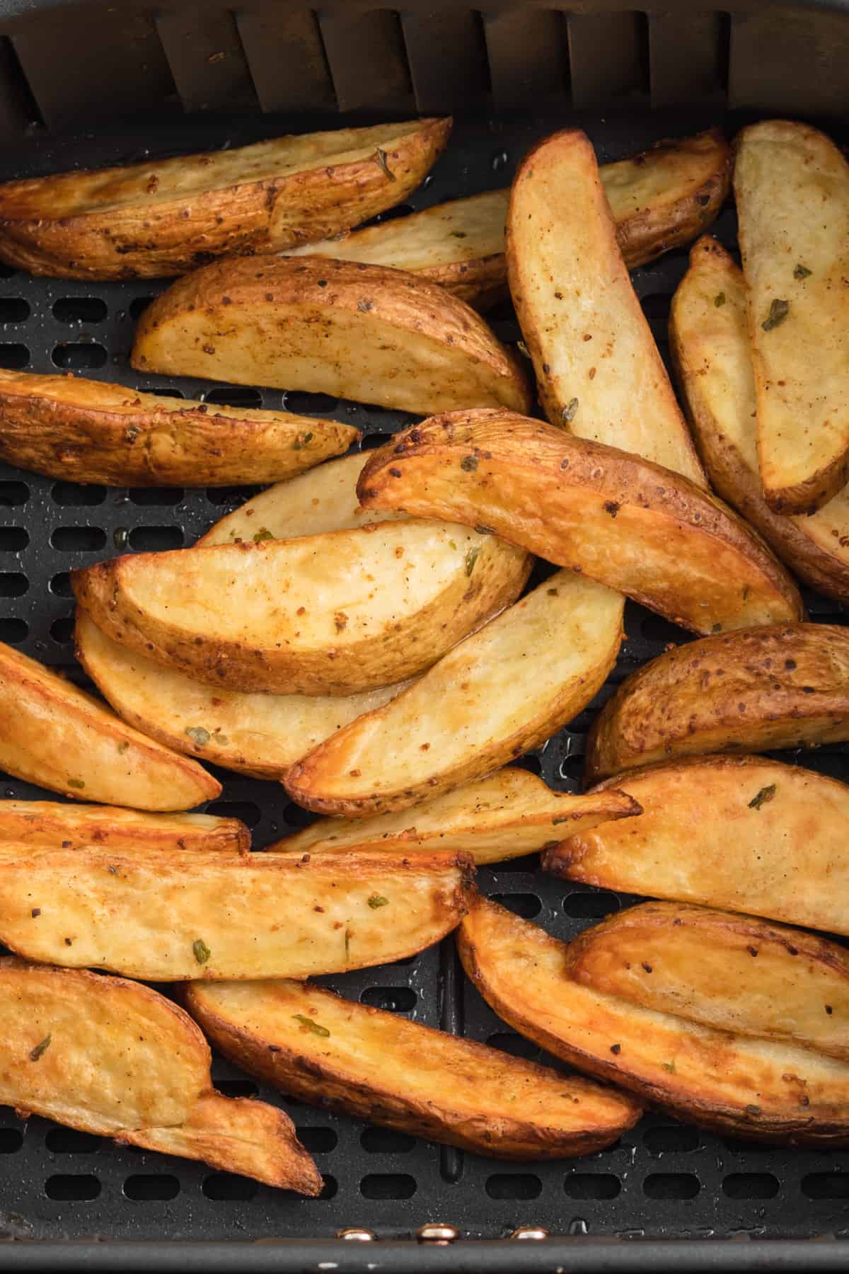 air fryer potato wedges in air fryer after cooking