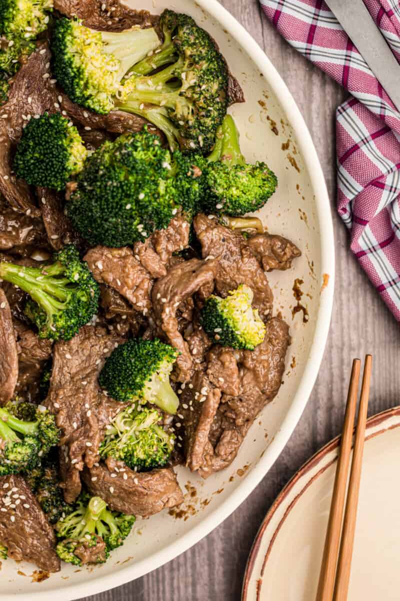 overhead image of beef and broccoli in a white bowl