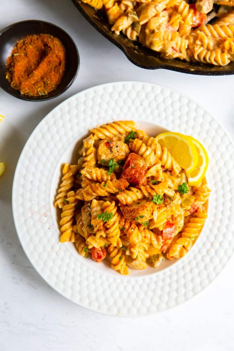 serving of cajun chicken pasta on a white plate