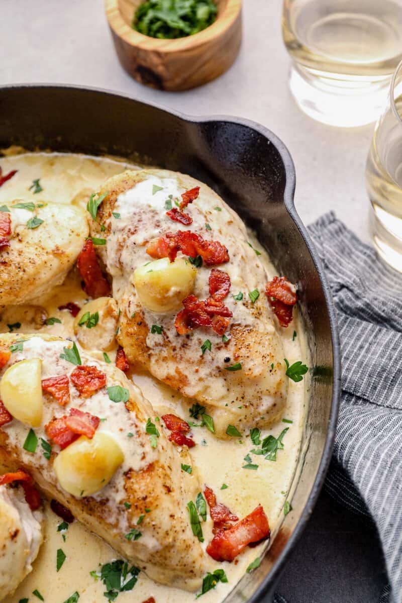 creamy garlic chicken with bacon in a skillet