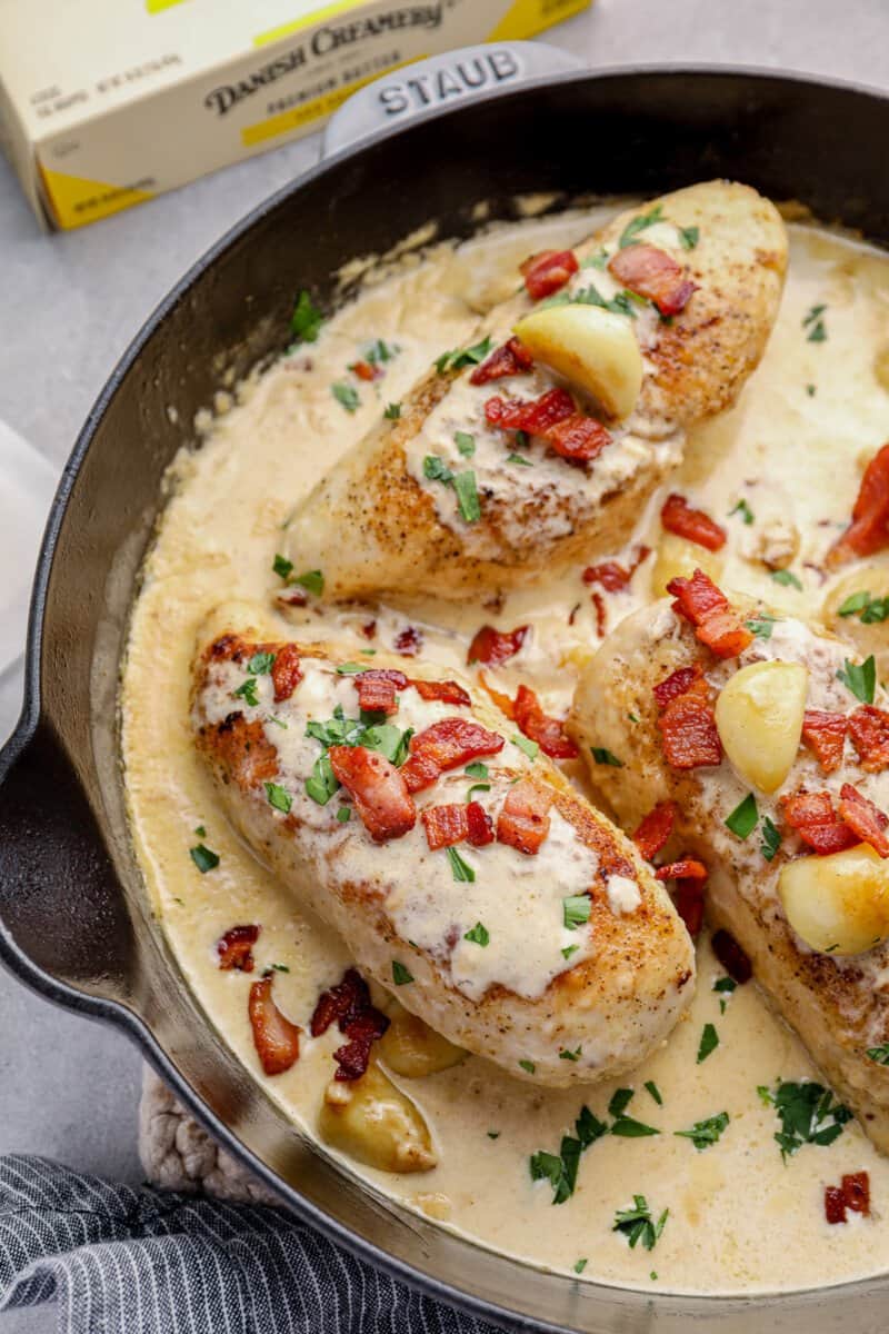 creamy garlic chicken with bacon in a skillet