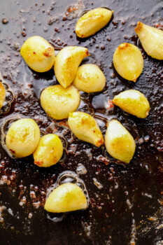 garlic cloves in a skillet