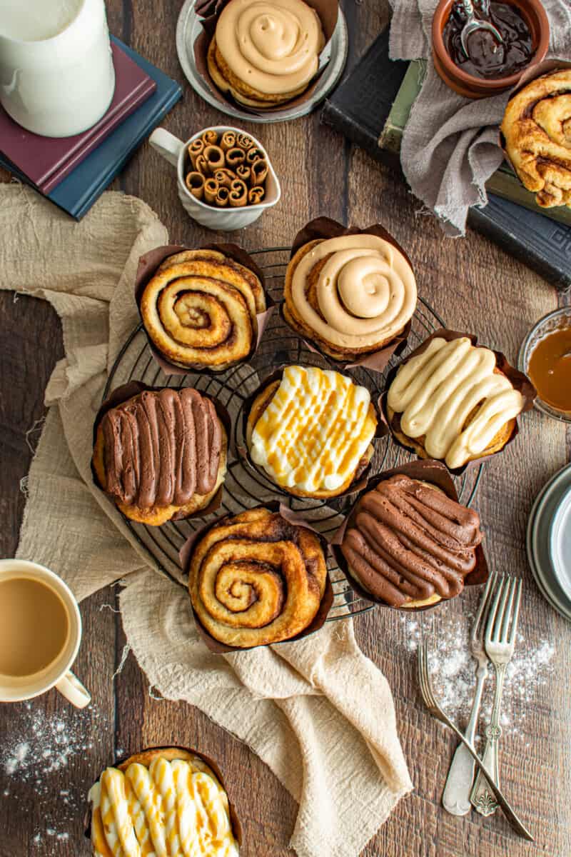 platter of bakery style cinnamon rolls, some with icing.