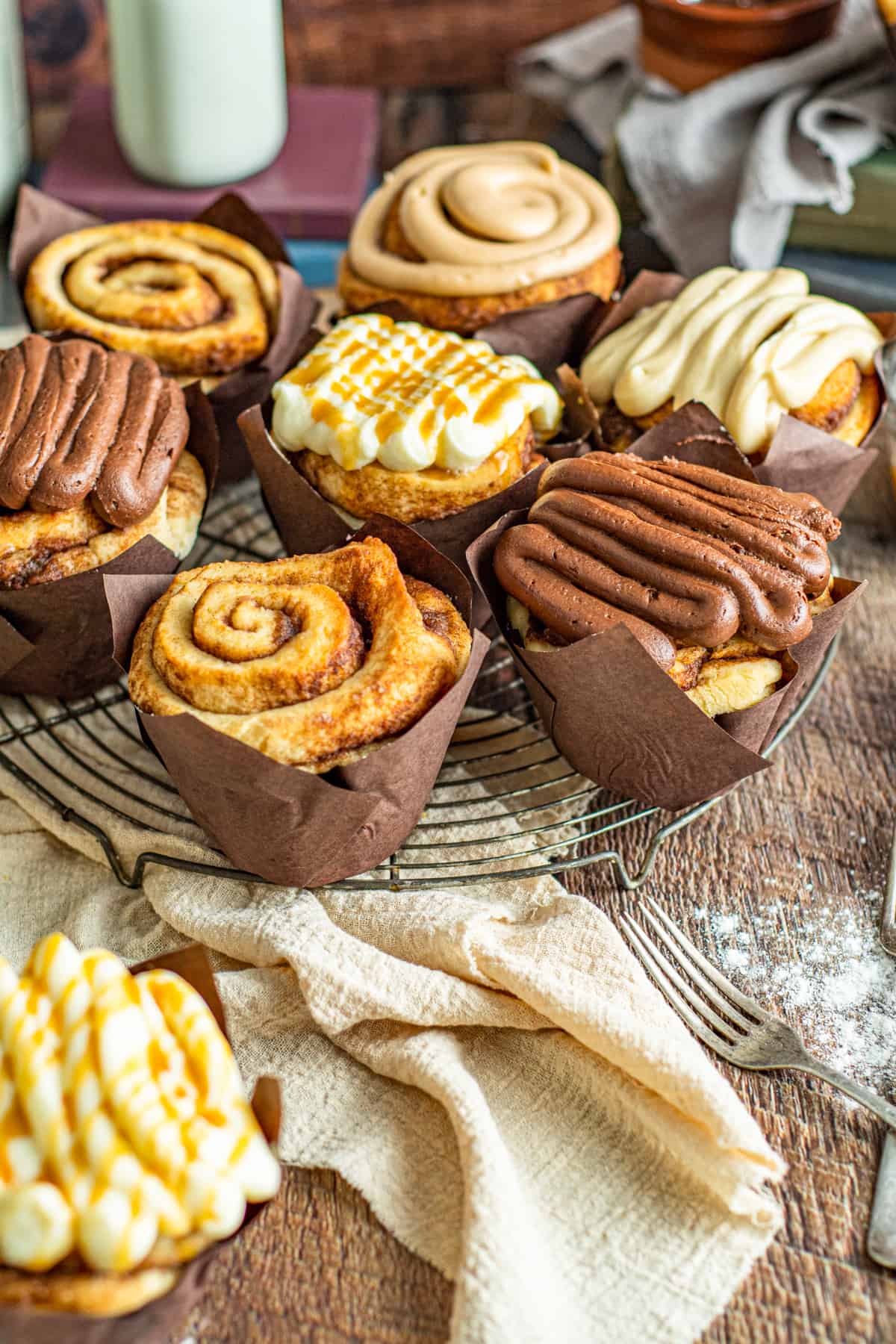 8 large cinnamon rolls with icing.