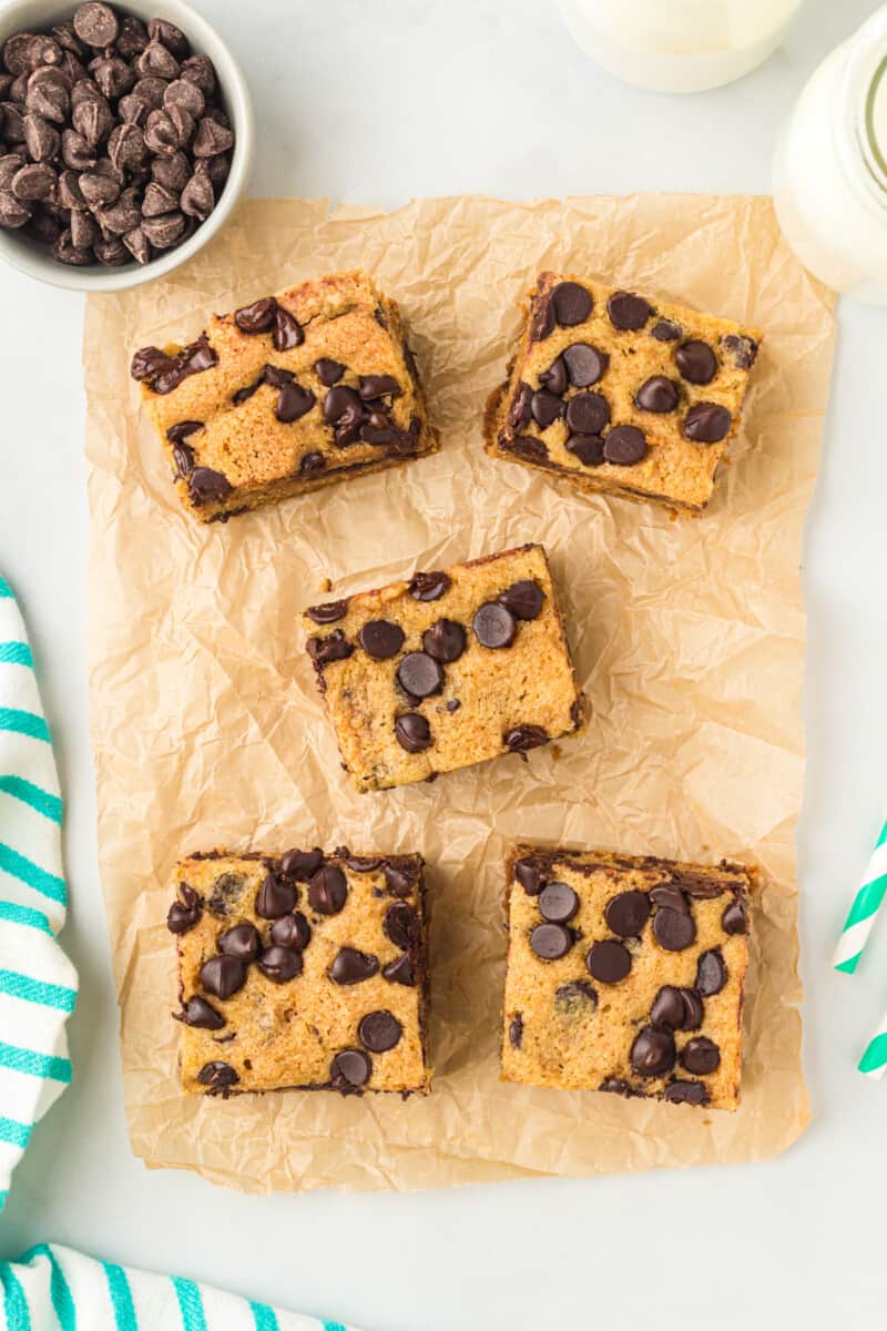 5 chocolate chip cookie bars on parchment paper.