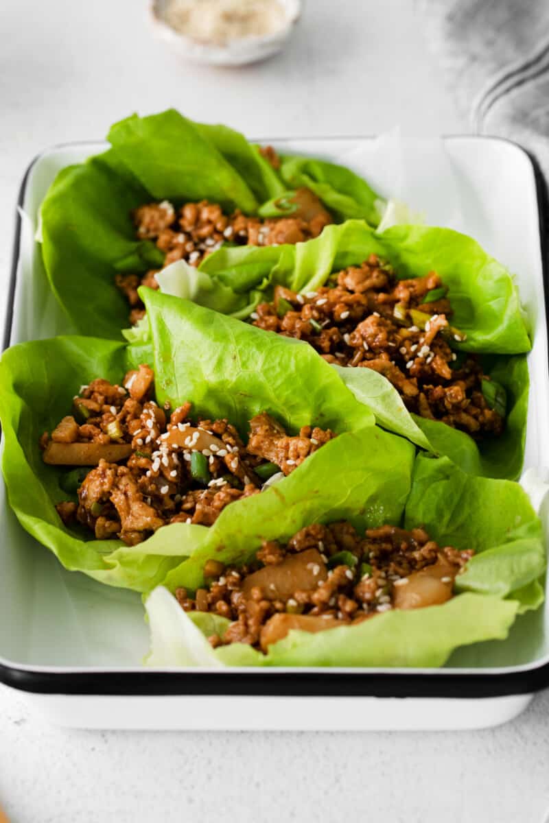 close up of pf changs lettuce wraps in a white tray.