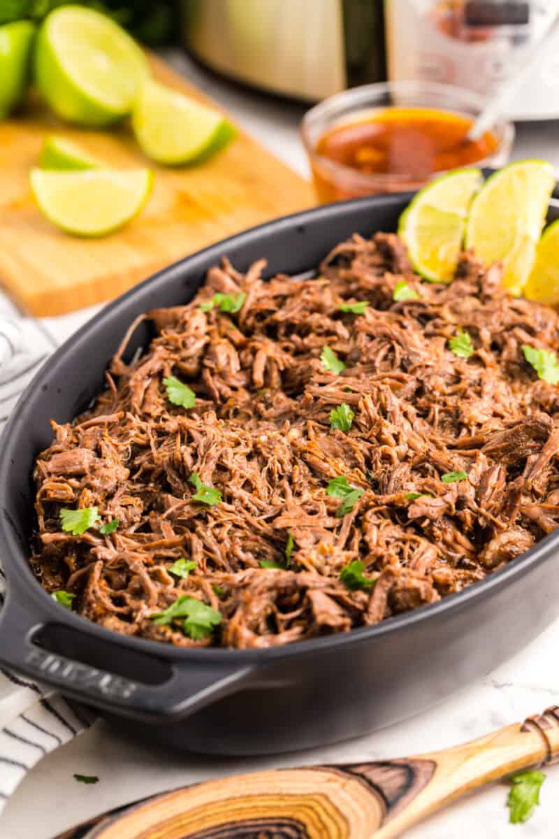 barbacoa beef in a cast iron serving vessel.