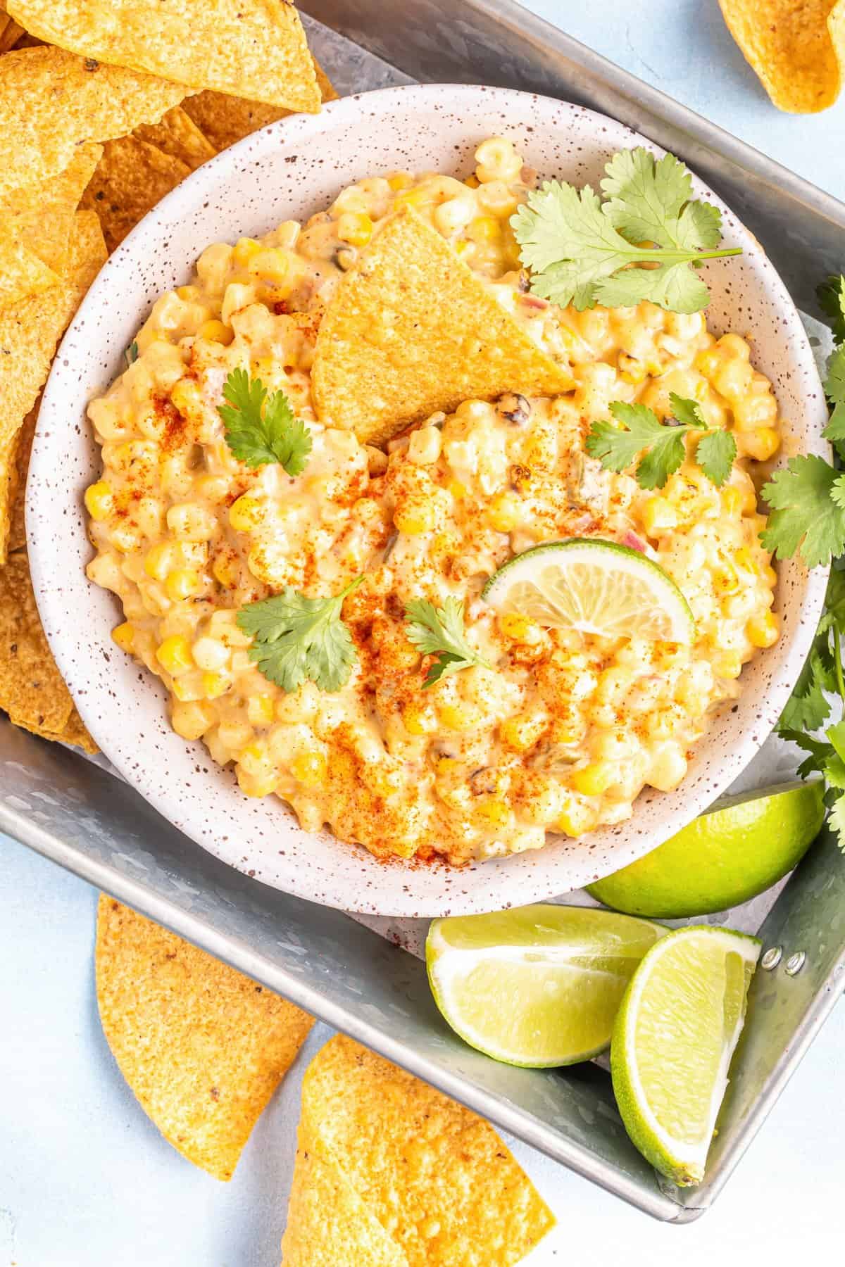 crockpot corn dip in a white bowl.