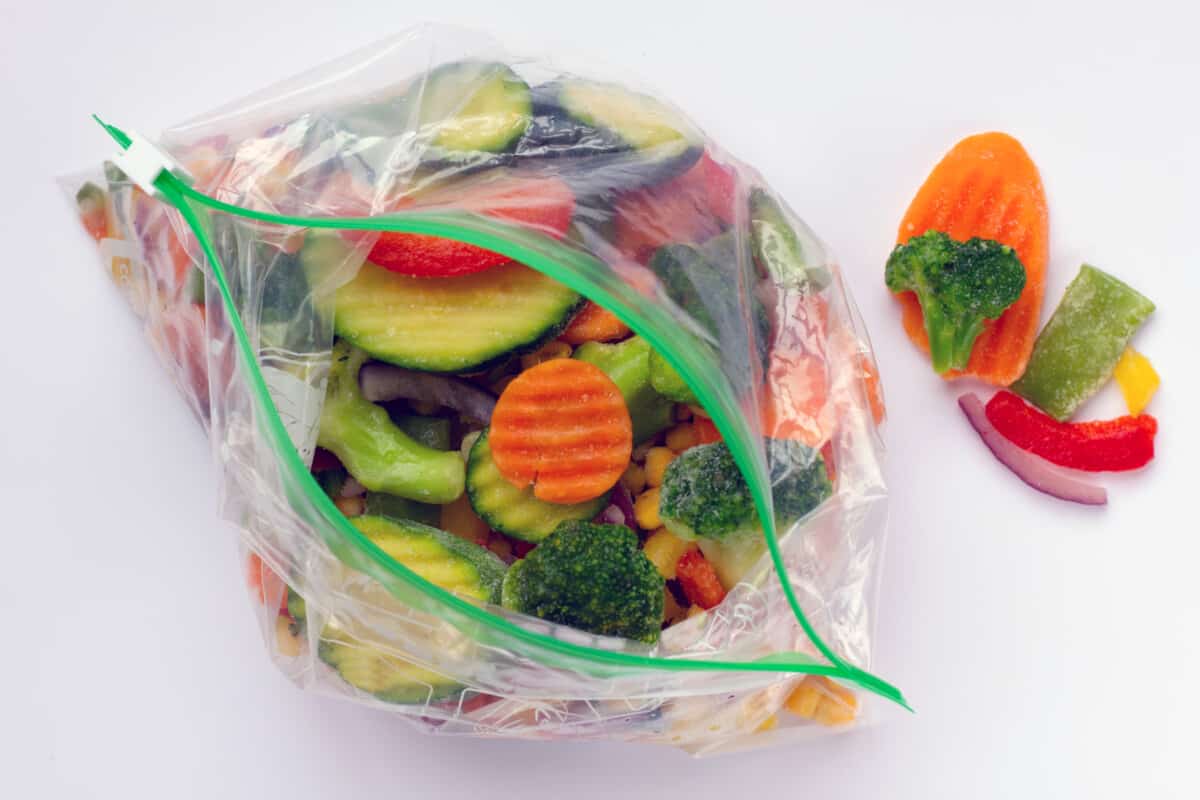 A bag of vegetables in a plastic bag on a white background.